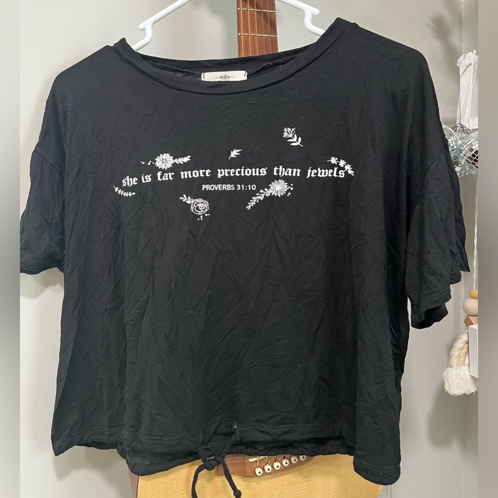 Cropped black Christian tee.